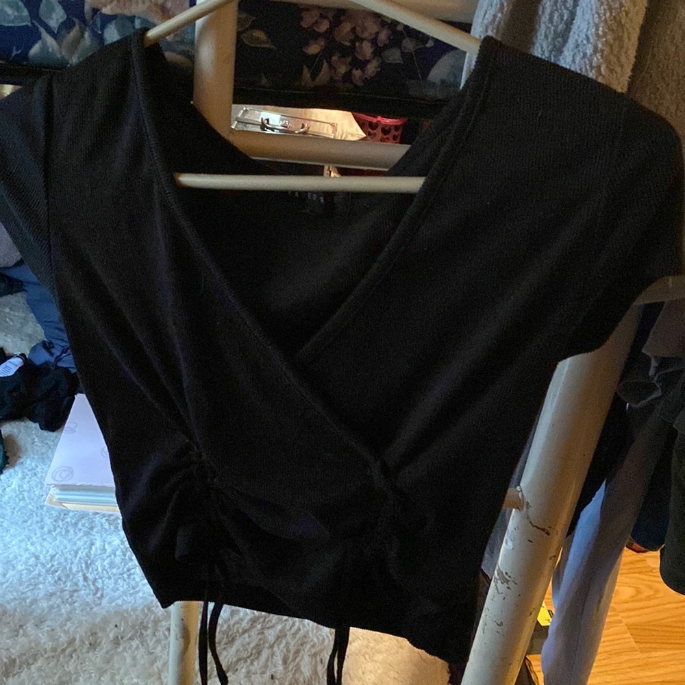 It’s a large V neck and a crop top